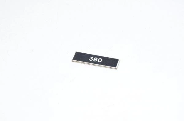Legend plate, black, 32x8mm rectangular, "380"